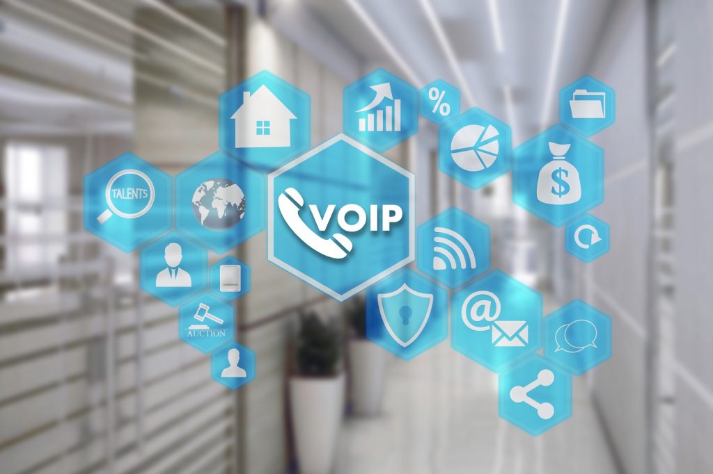 VOIP on the touch screen with a blur background of the office. The concept of Voice over Internet Protocol