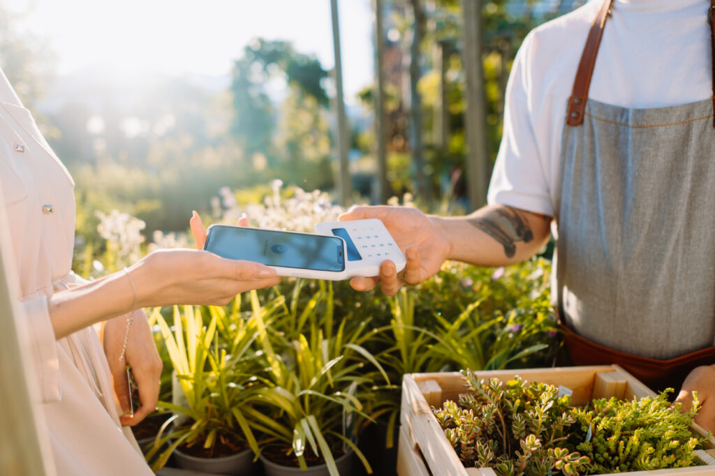 Mobile pos payment taken in a garden nursery.