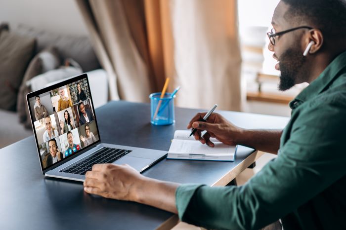 Business man using a video conferencing collaboration software to communicate internally.