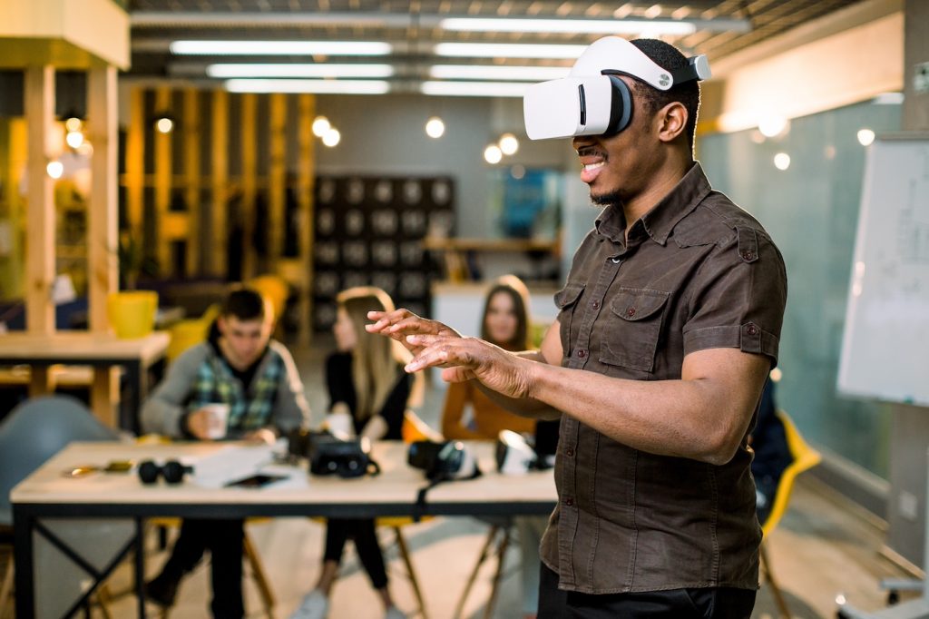 An employee uses a virtual reality headset during VR training.